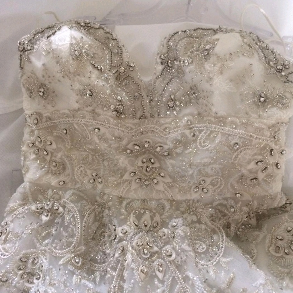 Never worn designer wedding gown